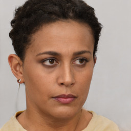 Neutral latino young-adult female with short  brown hair and brown eyes