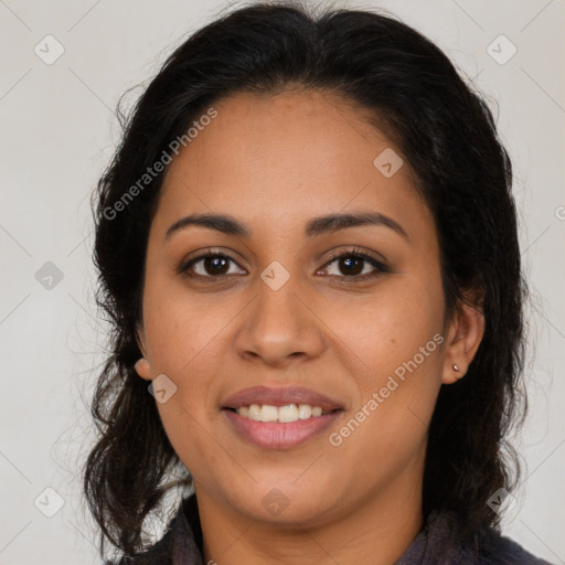 Joyful latino young-adult female with long  brown hair and brown eyes