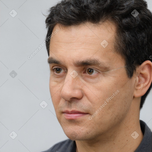 Neutral white adult male with short  black hair and brown eyes