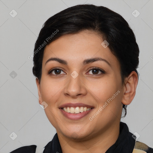 Joyful latino young-adult female with short  brown hair and brown eyes