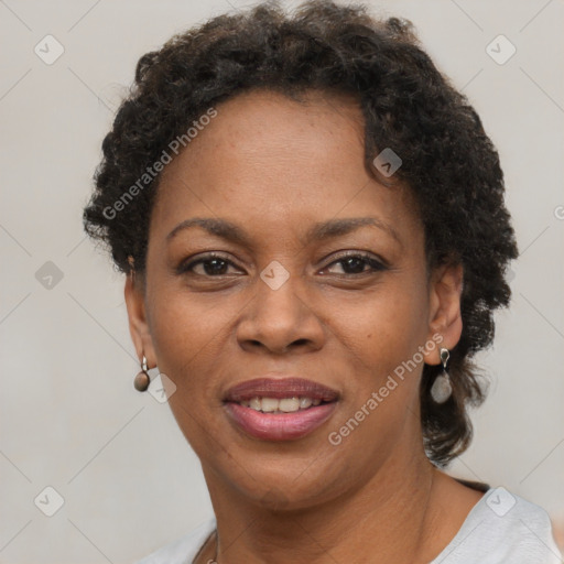 Joyful black adult female with short  brown hair and brown eyes