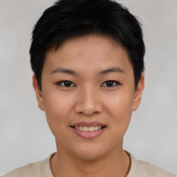 Joyful asian young-adult female with short  black hair and brown eyes