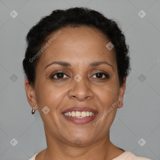 Joyful black adult female with short  brown hair and brown eyes