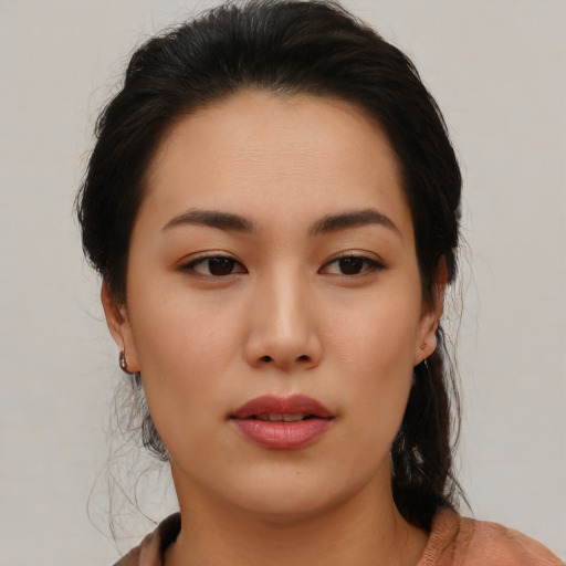 Neutral asian young-adult female with medium  brown hair and brown eyes