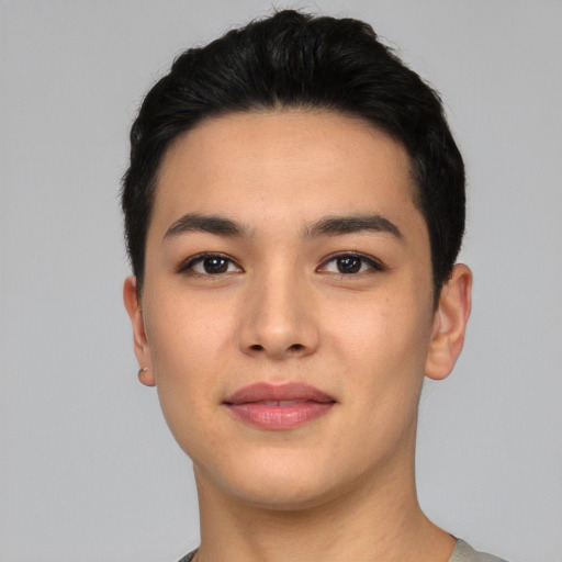 Joyful asian young-adult male with short  black hair and brown eyes