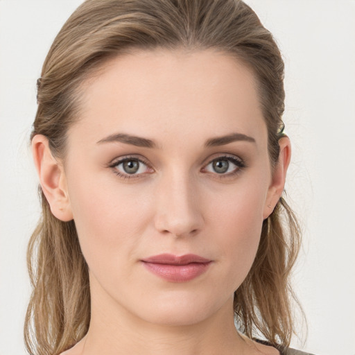 Joyful white young-adult female with long  brown hair and grey eyes