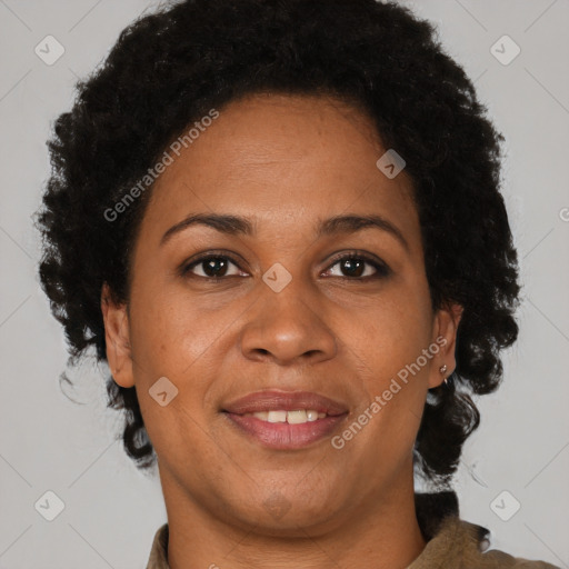 Joyful black adult female with short  brown hair and brown eyes