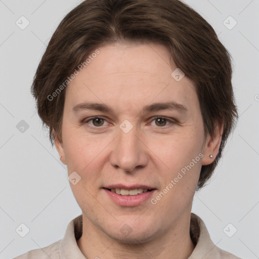 Joyful white adult female with short  brown hair and brown eyes