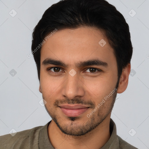 Joyful latino young-adult male with short  black hair and brown eyes