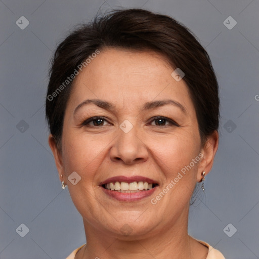 Joyful white adult female with short  brown hair and brown eyes