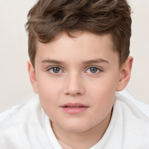 Joyful white child male with short  brown hair and brown eyes