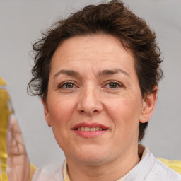 Joyful white adult female with short  brown hair and brown eyes