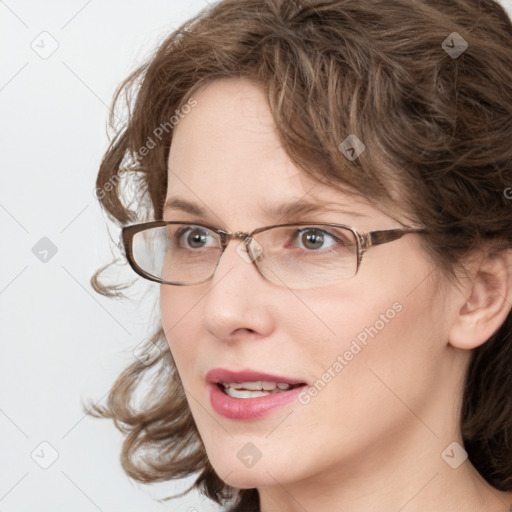 Joyful white young-adult female with medium  brown hair and blue eyes