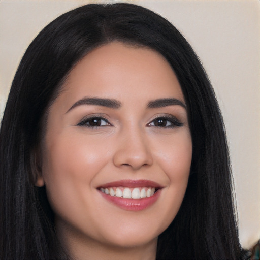 Joyful white young-adult female with long  black hair and brown eyes