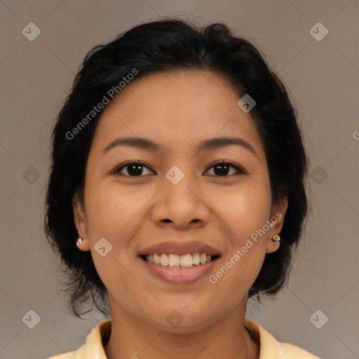 Joyful latino young-adult female with medium  brown hair and brown eyes