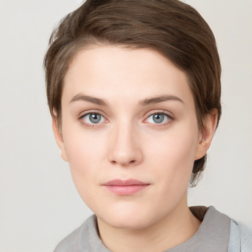 Neutral white young-adult female with short  brown hair and grey eyes