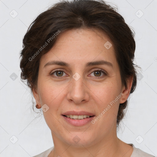 Joyful white adult female with short  brown hair and brown eyes