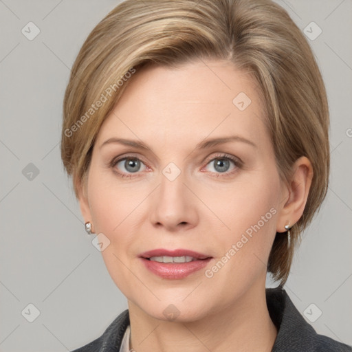 Joyful white adult female with medium  brown hair and grey eyes