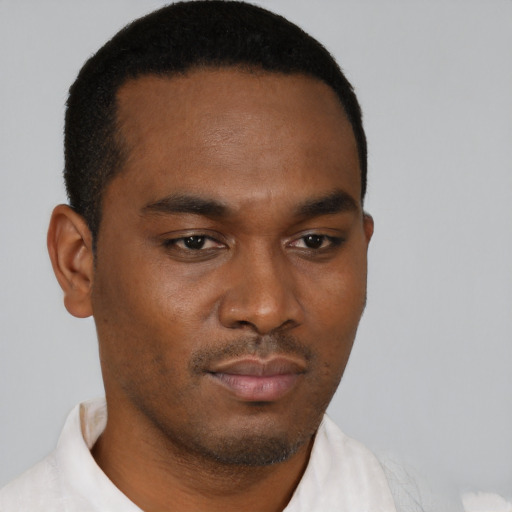 Neutral black young-adult male with short  brown hair and brown eyes