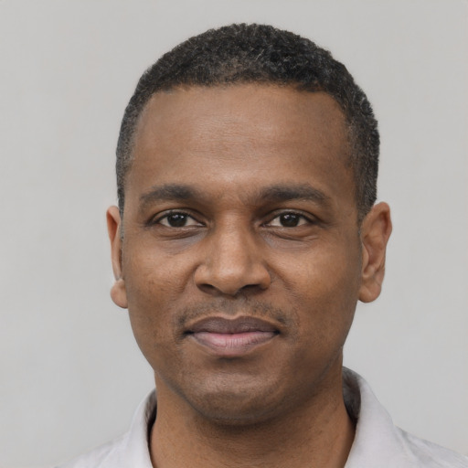 Neutral black young-adult male with short  black hair and brown eyes