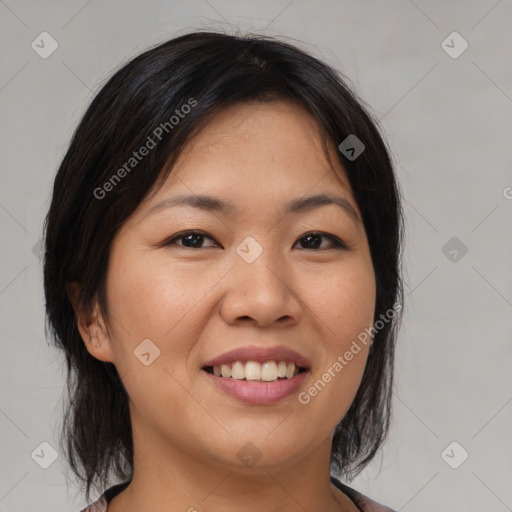 Joyful asian young-adult female with medium  brown hair and brown eyes