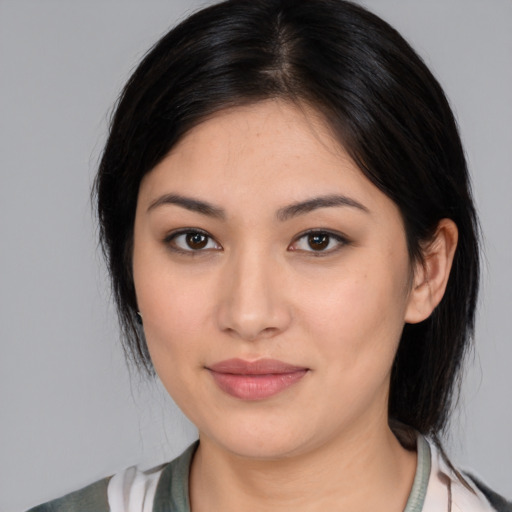 Joyful white young-adult female with medium  black hair and brown eyes
