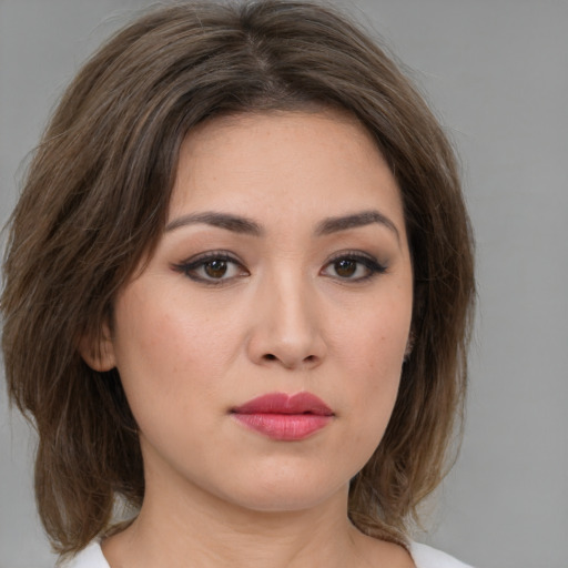 Neutral white young-adult female with medium  brown hair and brown eyes