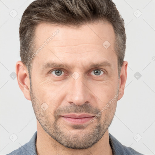 Joyful white adult male with short  brown hair and grey eyes