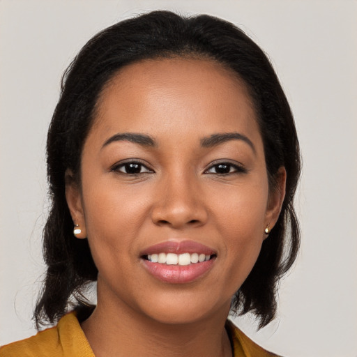 Joyful latino young-adult female with long  black hair and brown eyes