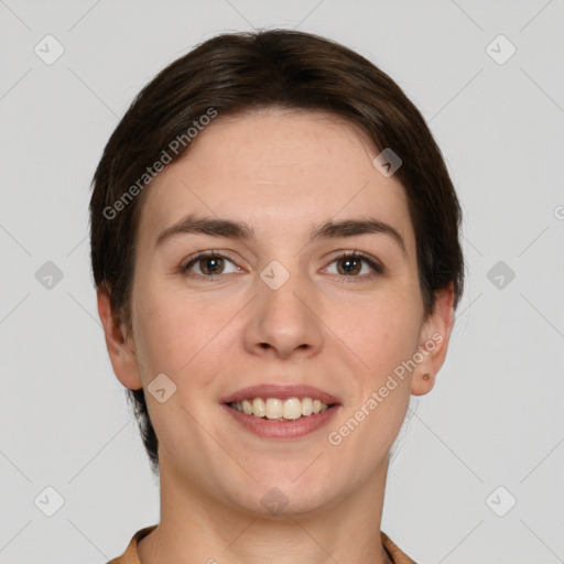 Joyful white young-adult female with short  brown hair and grey eyes