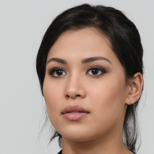 Neutral asian young-adult female with medium  black hair and brown eyes