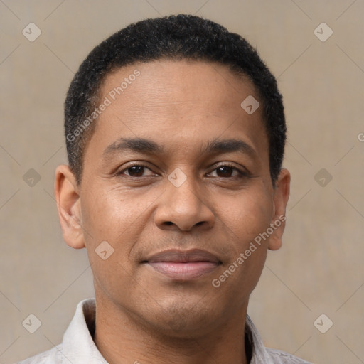 Joyful latino young-adult male with short  brown hair and brown eyes