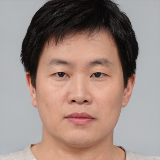 Neutral asian young-adult male with short  black hair and brown eyes