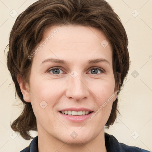 Joyful white young-adult female with medium  brown hair and grey eyes