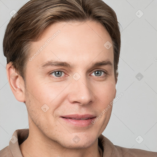 Joyful white young-adult male with short  brown hair and grey eyes