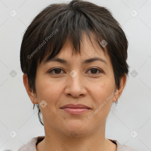 Joyful white adult female with short  brown hair and brown eyes