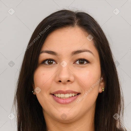 Joyful latino young-adult female with long  brown hair and brown eyes