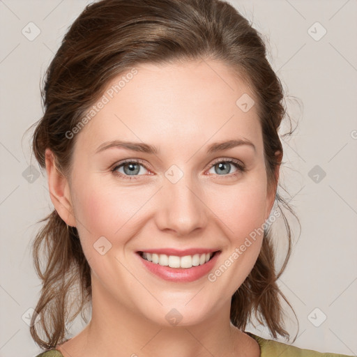 Joyful white young-adult female with medium  brown hair and green eyes