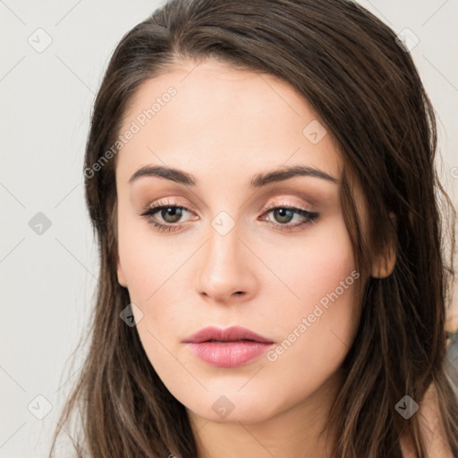 Neutral white young-adult female with long  brown hair and brown eyes