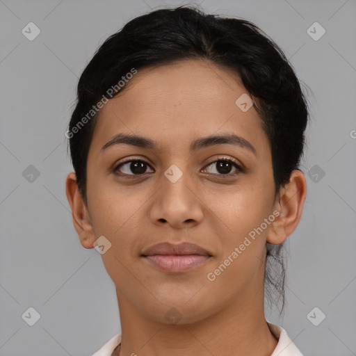 Joyful latino young-adult female with short  brown hair and brown eyes