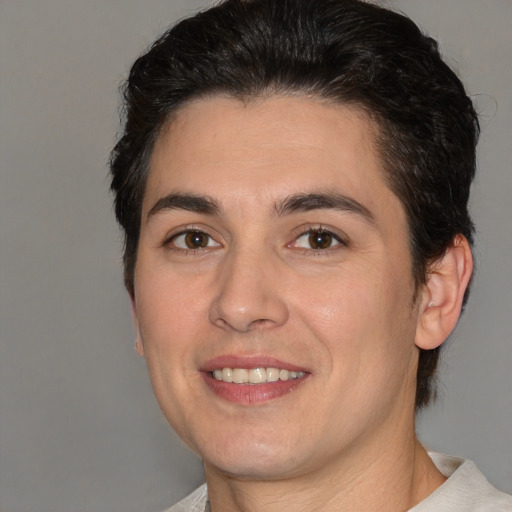 Joyful white young-adult male with medium  brown hair and brown eyes