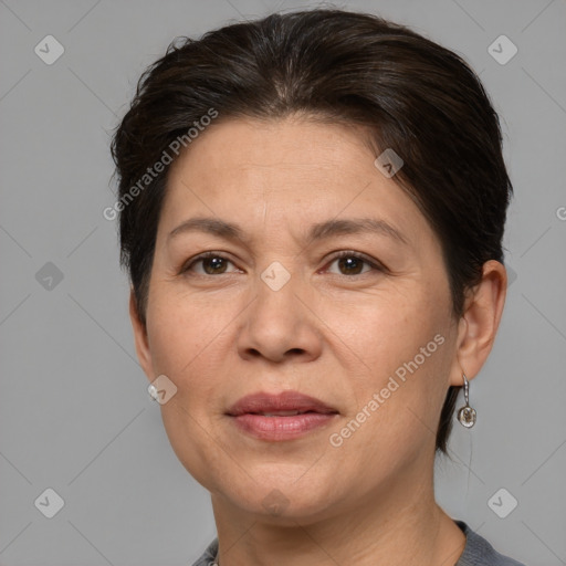 Joyful white adult female with medium  brown hair and brown eyes