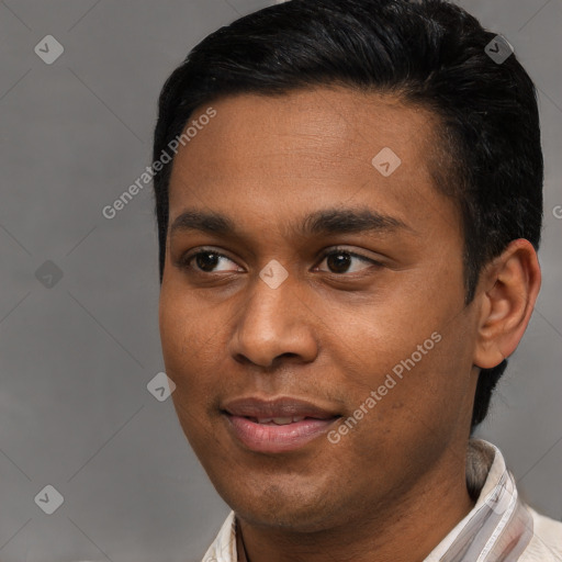 Joyful latino young-adult male with short  black hair and brown eyes