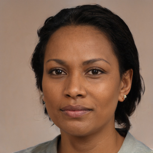 Neutral black adult female with medium  black hair and brown eyes