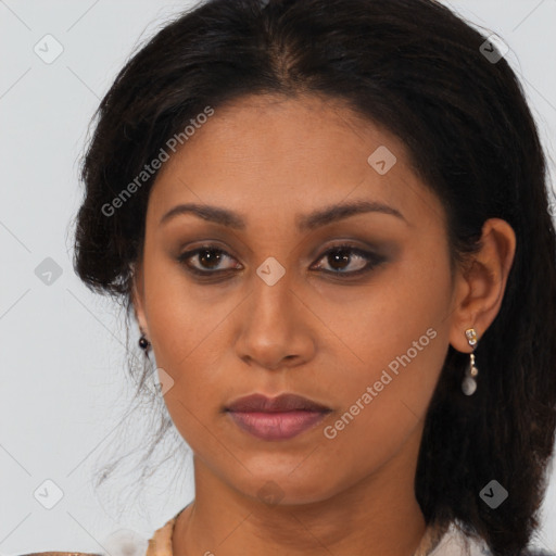 Joyful latino young-adult female with medium  brown hair and brown eyes