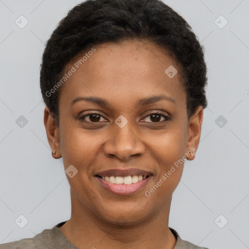 Joyful black young-adult female with short  brown hair and brown eyes