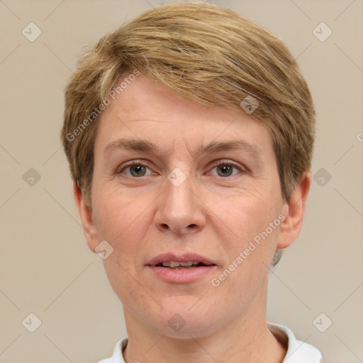 Joyful white adult female with short  brown hair and brown eyes