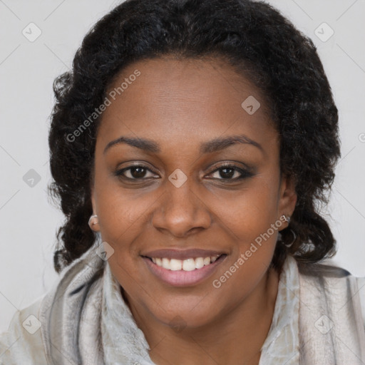 Joyful black young-adult female with long  brown hair and brown eyes