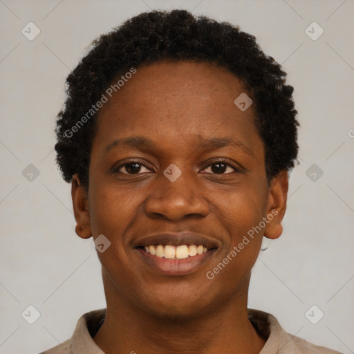 Joyful black young-adult female with short  black hair and brown eyes