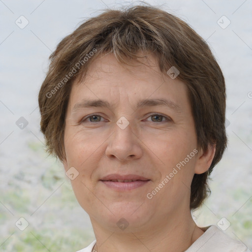 Joyful white adult female with short  brown hair and brown eyes